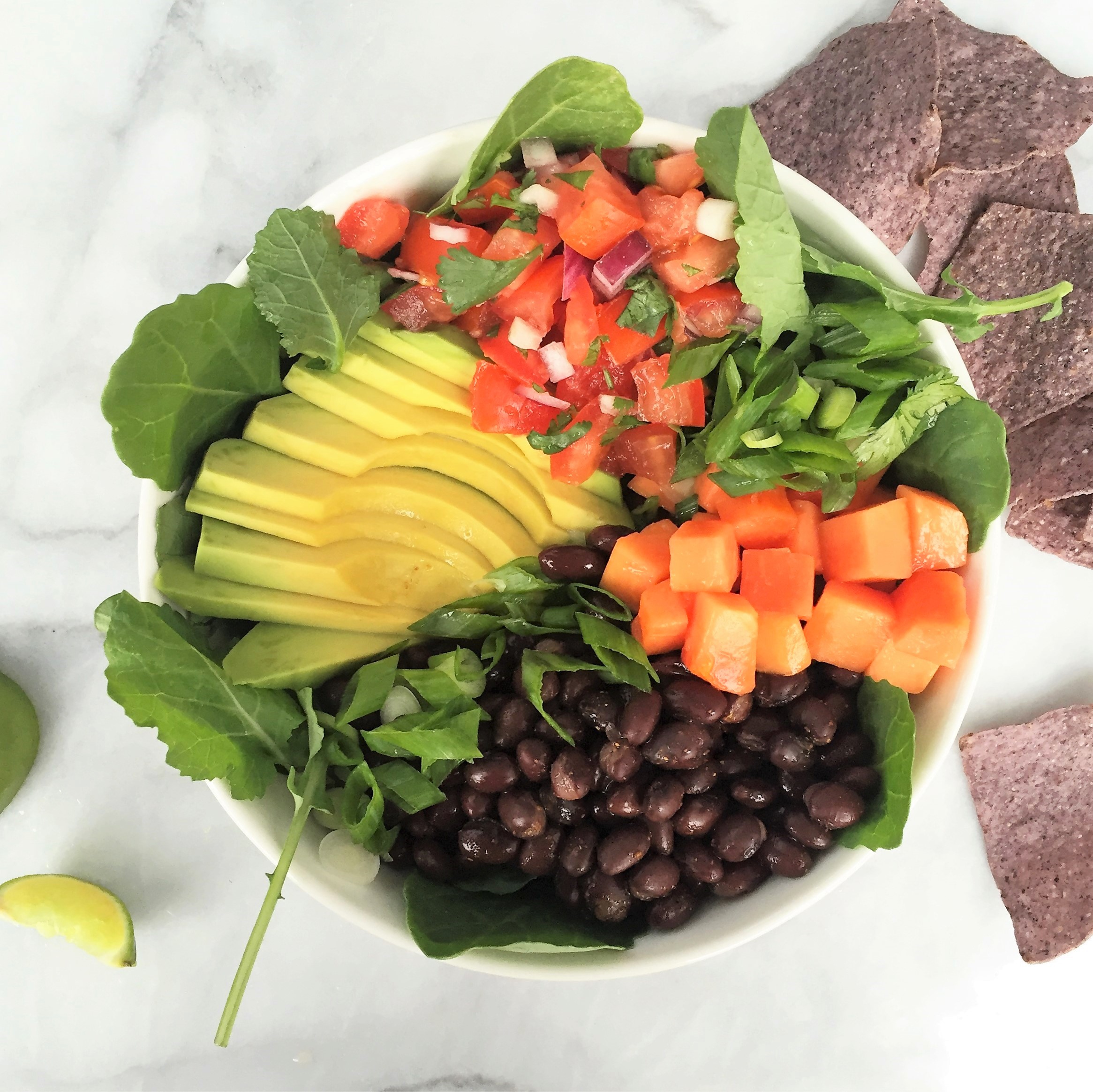 black bean, papaya, and power green taco salad bowl
