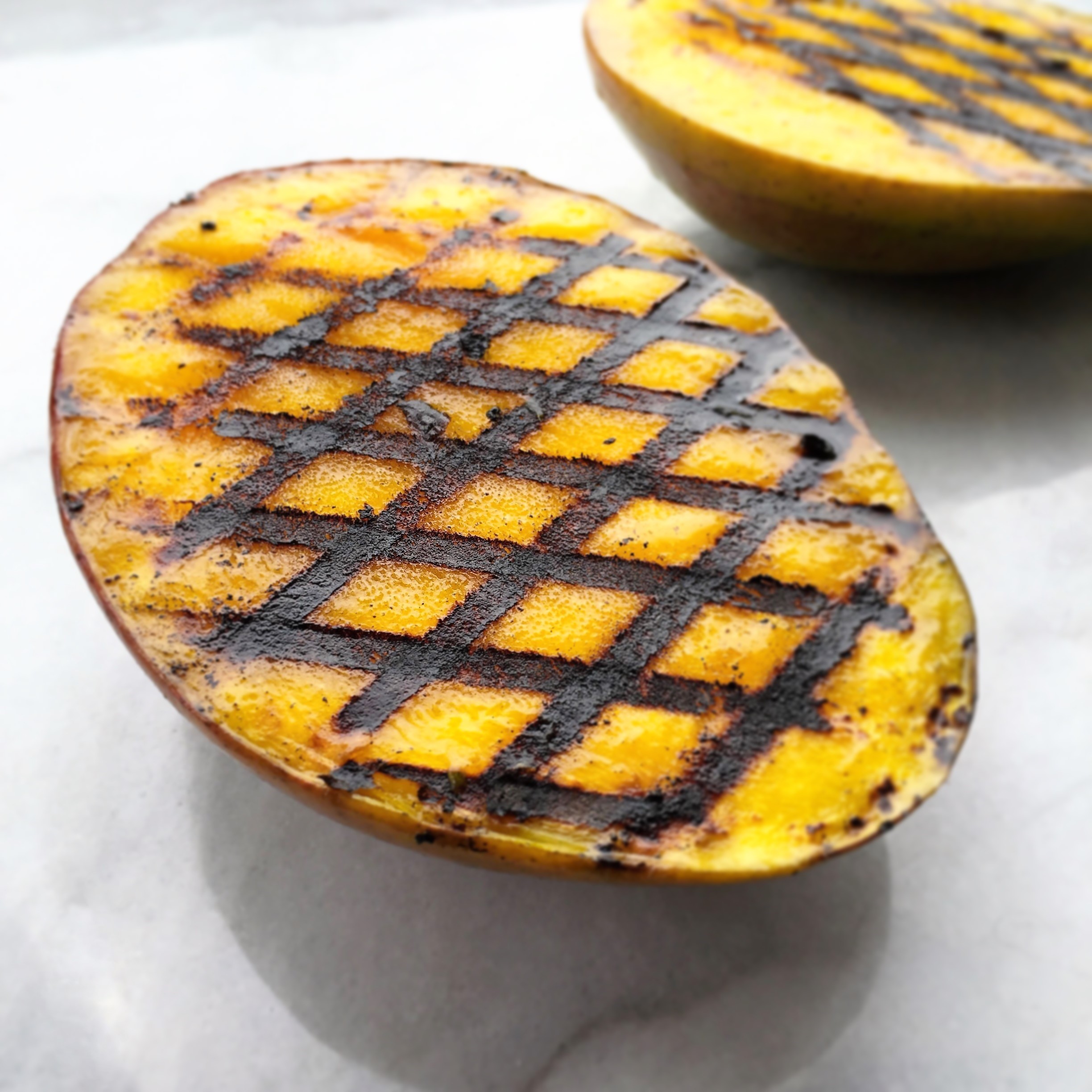 grilled mango cheeks