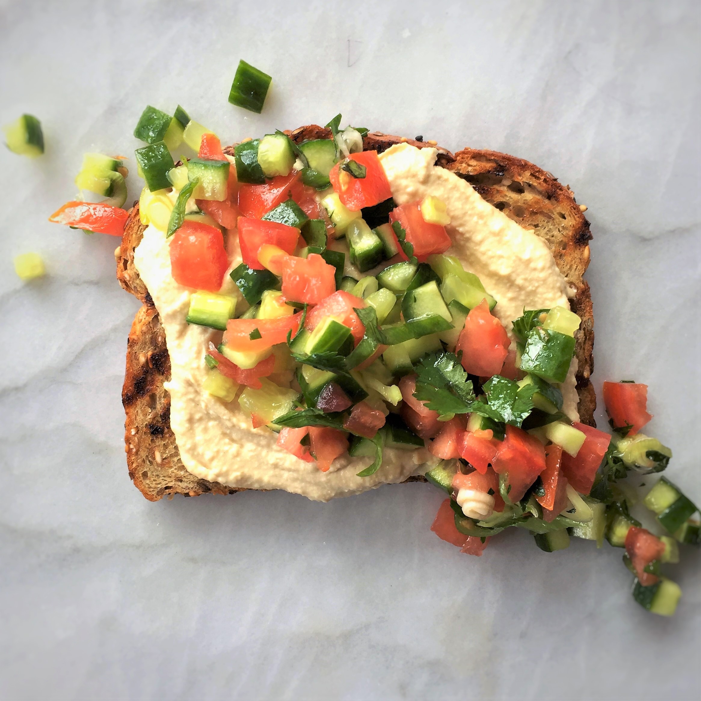 grilled hummus toast with middle eastern “salsa”