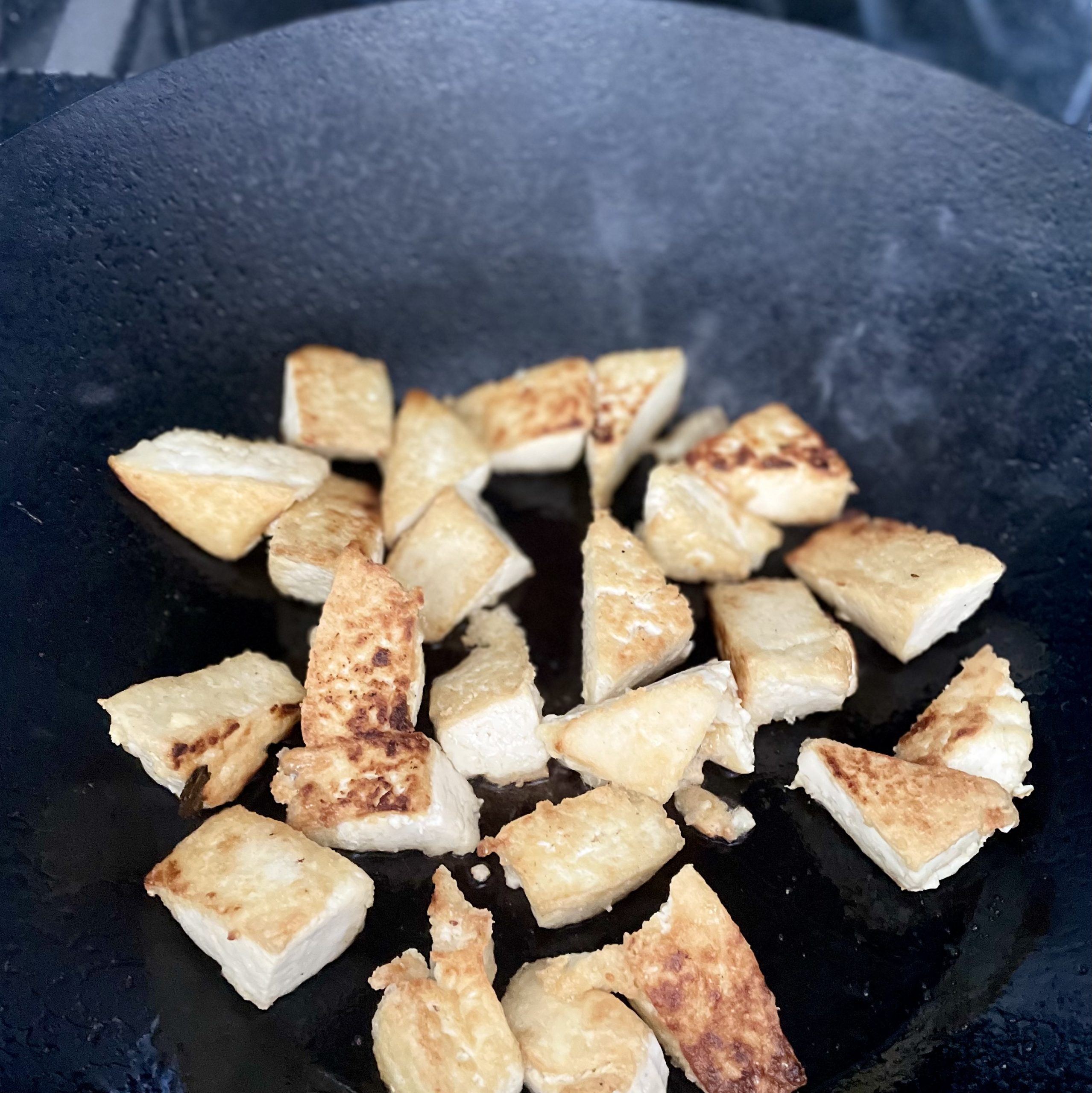 general tso’s tofu with cauliflower _browned tofu in wok