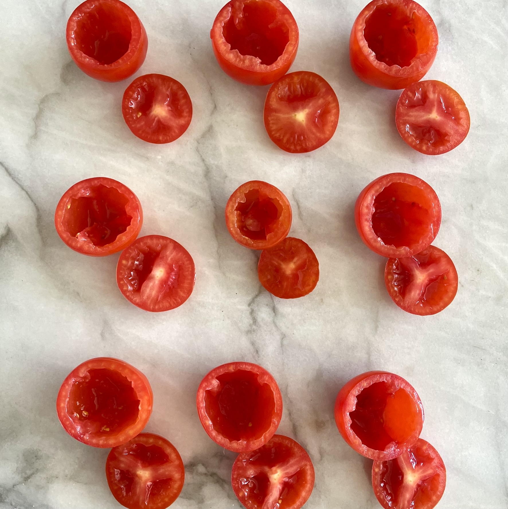 Salad-Stuffed Campari Tomatoes_scooped out tomatoes on marble