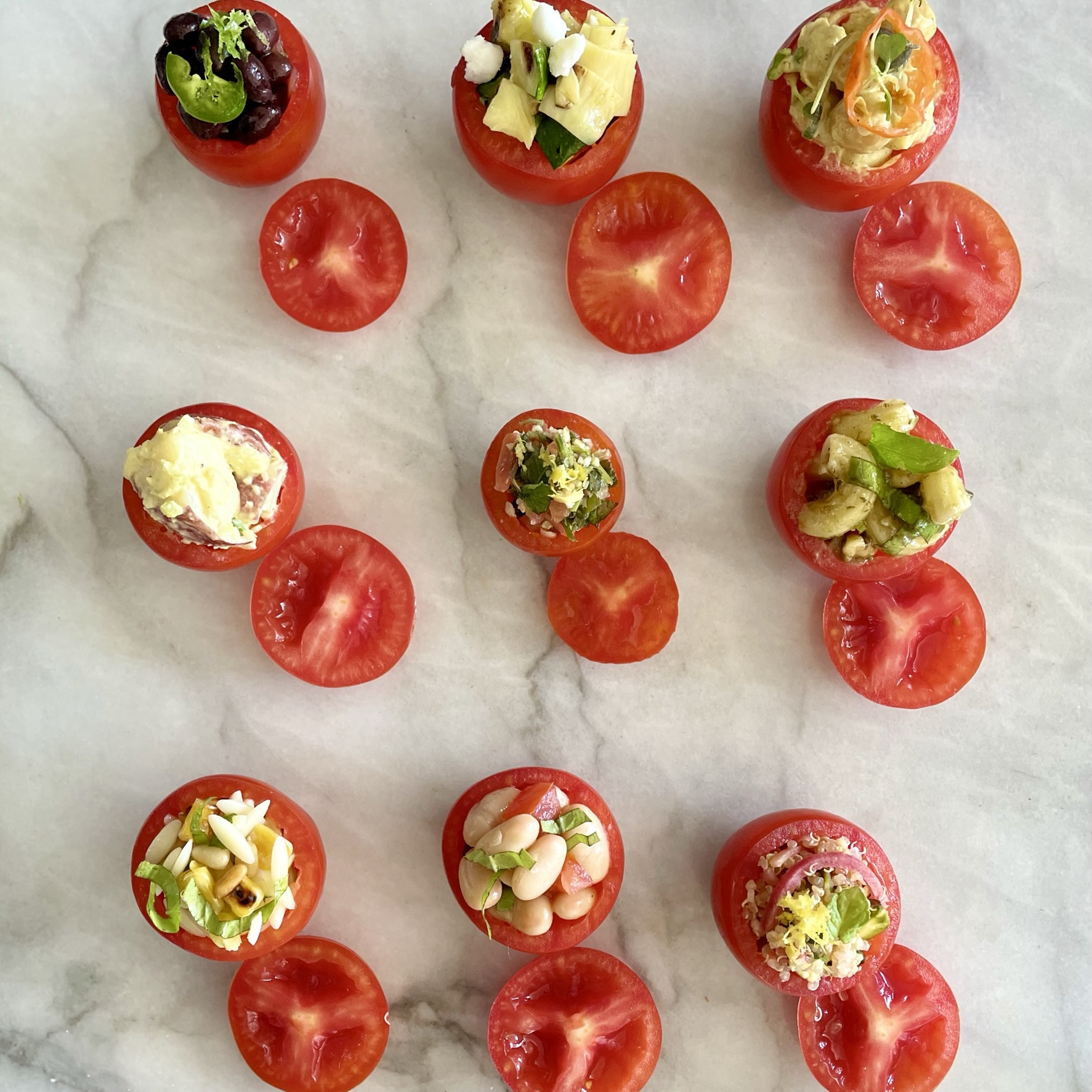 Salad-Stuffed Campari Tomatoes_nine stuffed tomatoes on marble