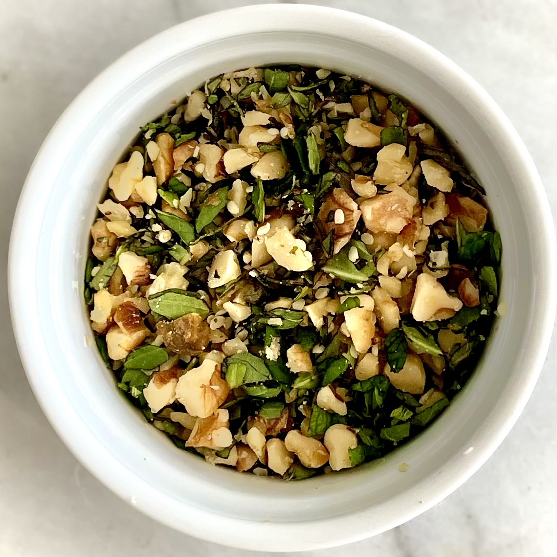 leftover chopped walnuts and basil for plant-based goat cheese and grape pops recipe