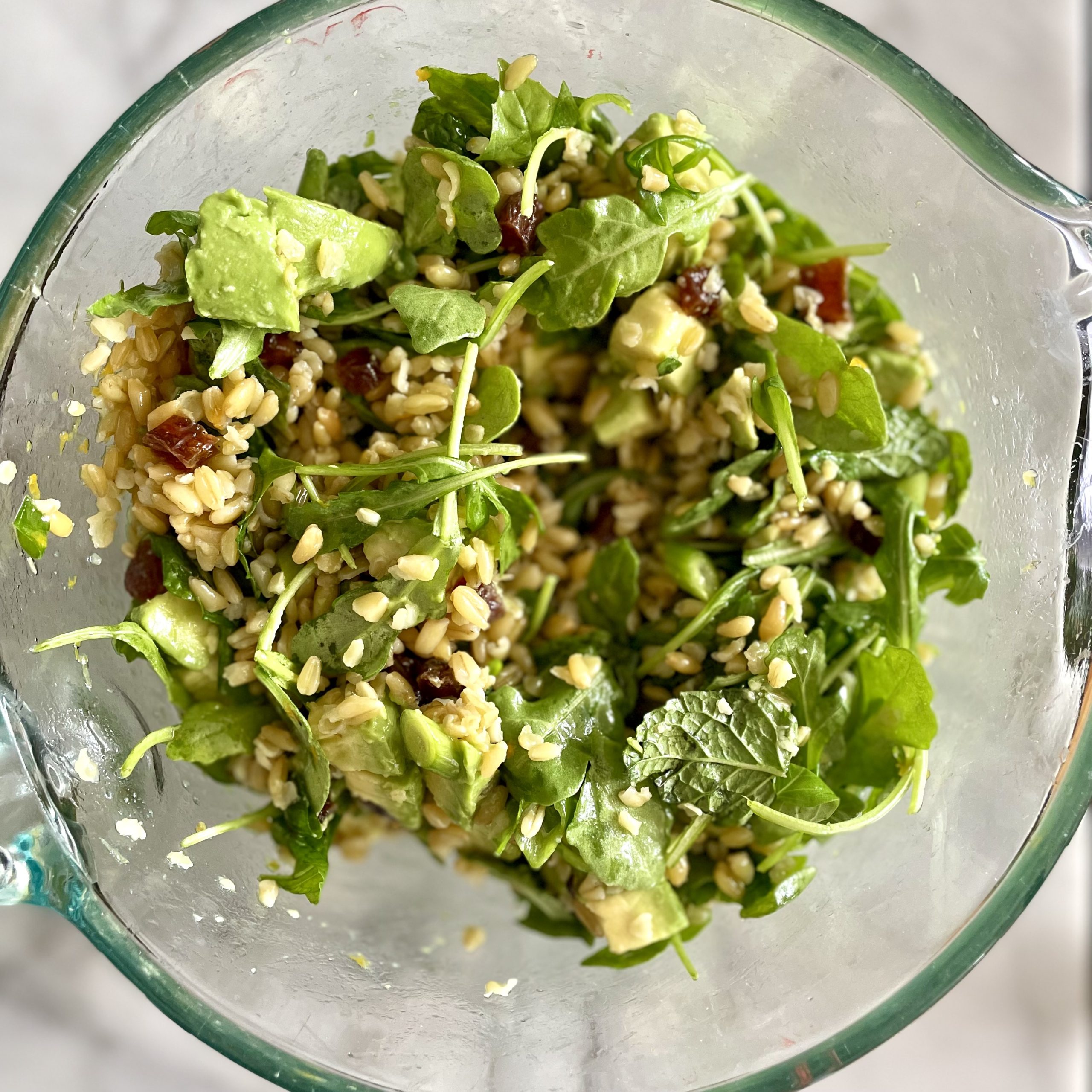 herbed freekeh salad with avocado, pistachios and citrus vinaigrette_in mixing bowl