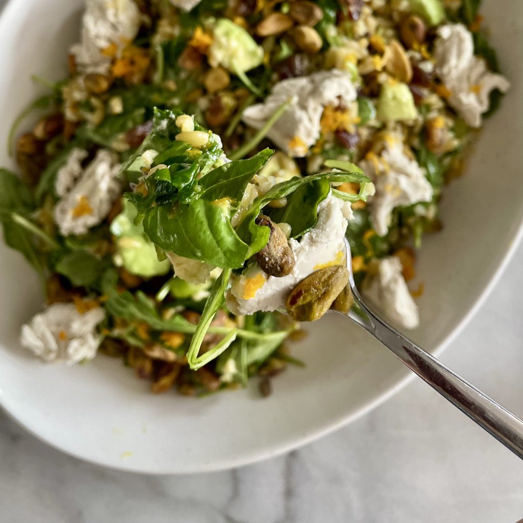 herbed freekeh salad with avocado, pistachios and citrus vinaigrette_with serving fork closeup
