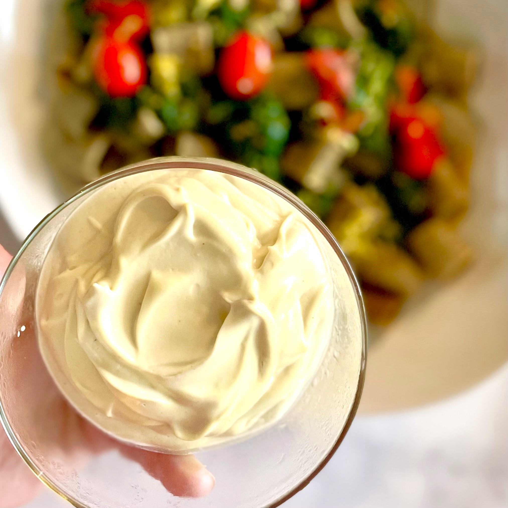bowl of soft plant-based cheese for easy one-pot pasta with lemony greens and cashew cheese