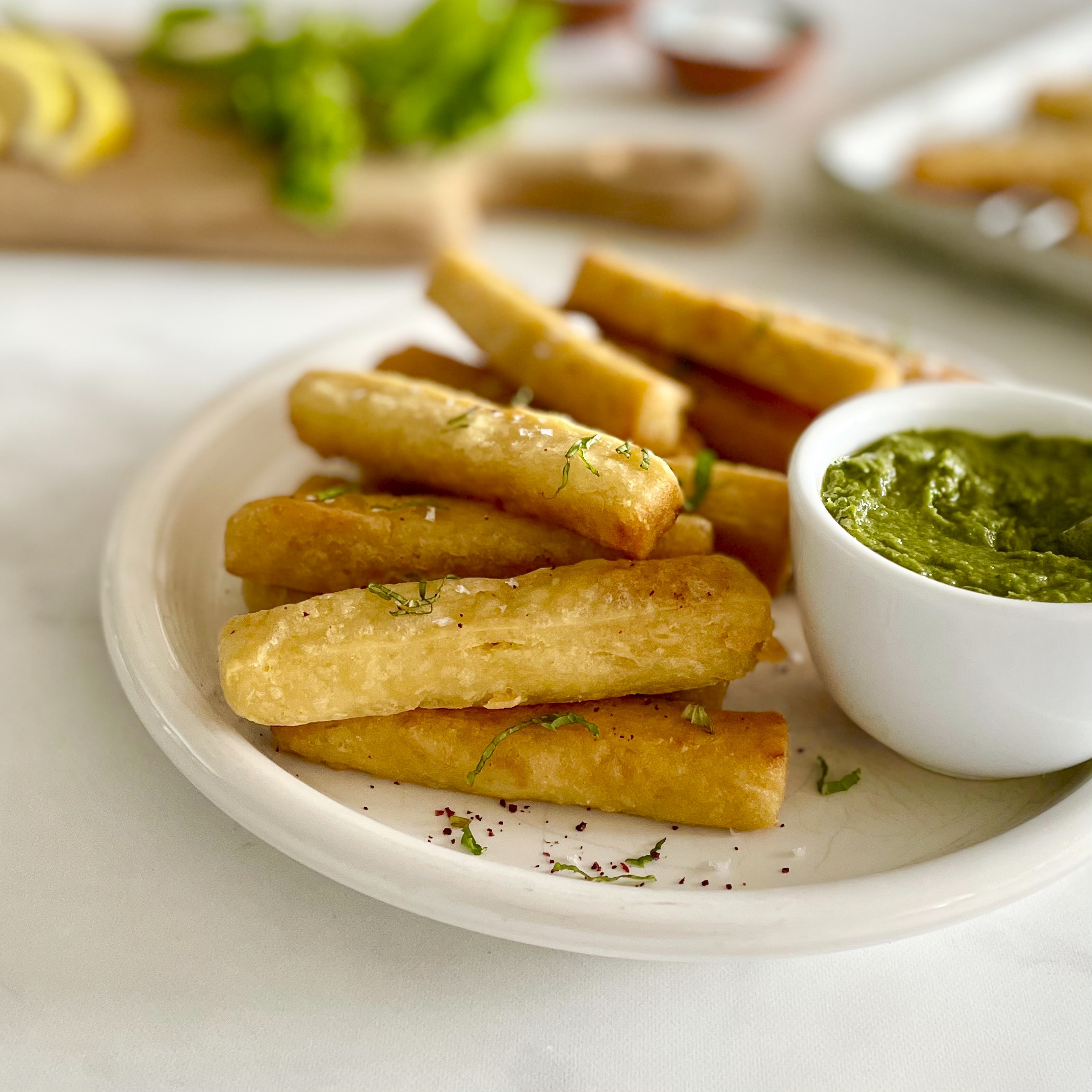 angled view of chickpea fries with zhoug
