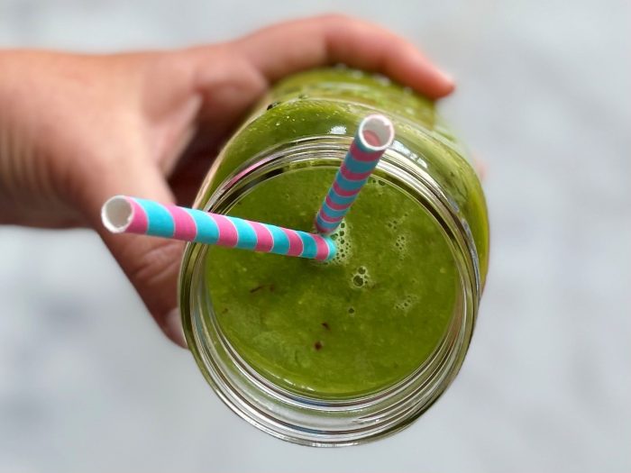 A jar with a green smoothie