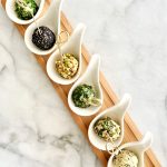 plant-based goat cheese and grape pops on long appetizers platter