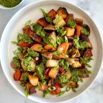 skillet russet & sweet potato hash with small bowl of arugula pesto on the side