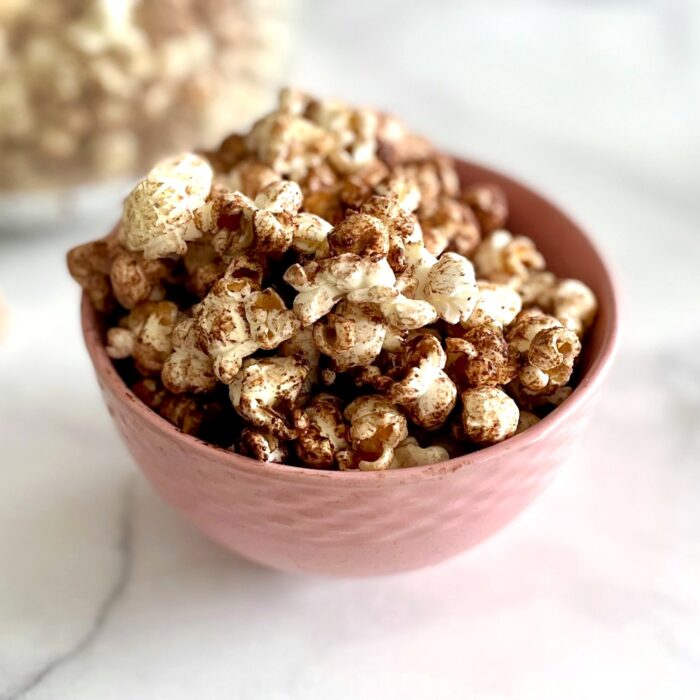 a pink bowl of chocolate lover's popcorn