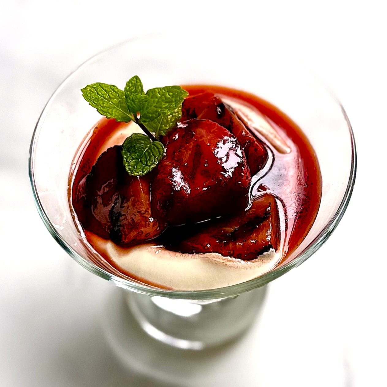 serving of grilled strawberries over vanilla pudding